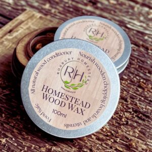 Tin of Wood Wax on wooden slab