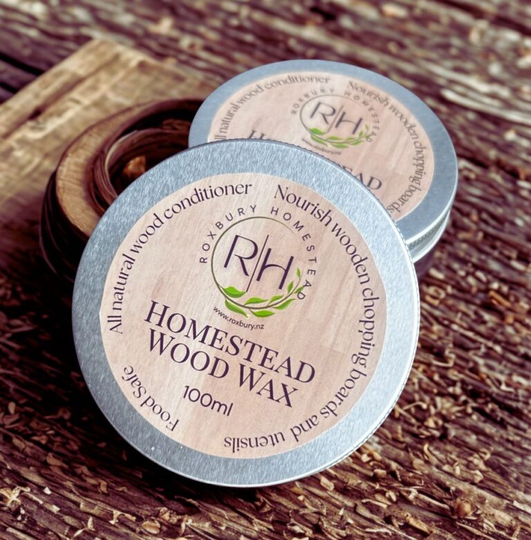 Tin of Wood Wax on wooden slab